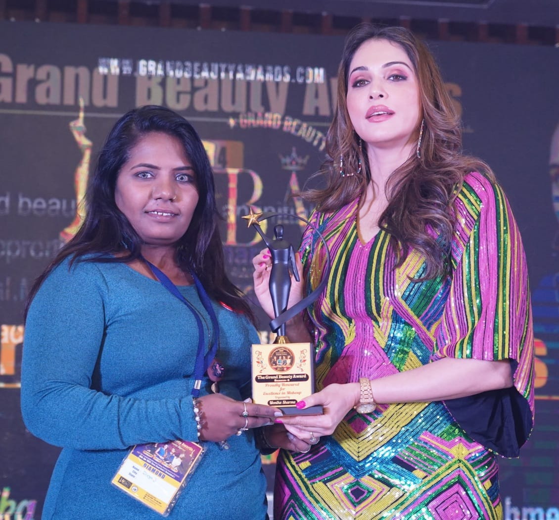 Founder of Prayosha Salon & Academy receiving the Grand Beauty Award for excellence in makeup